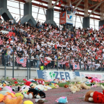 Zakho SC fans throwing stuffed animals on the pitch to be donated to children with cancer. Photo: Zakho SC