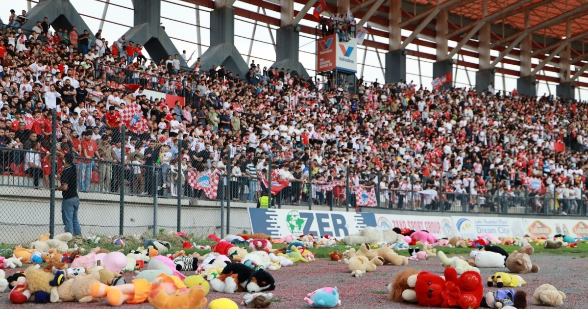 Zakho SC fans throwing stuffed animals on the pitch to be donated to children with cancer. Photo: Zakho SC